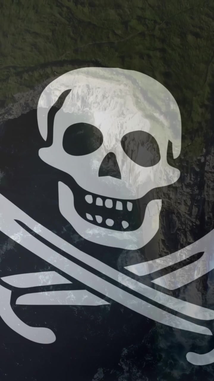 Animazione di una bandiera pirata che sventola sulla costa e sul mare