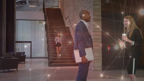 animation of network of connections over diverse businessman and businesswoman discussing at office