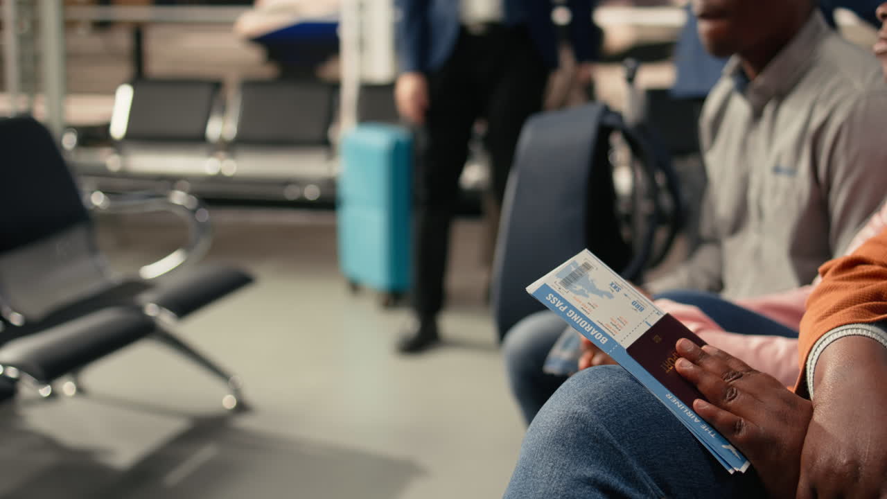 Close up of boarding pass and passport in airport terminal lounge area