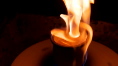 burning ceramic mug on pottery wheel