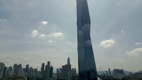 aerial view of merdeka 118 skyscraper in malaysia, kuala lumpur windows reflect the blue sky and clouds