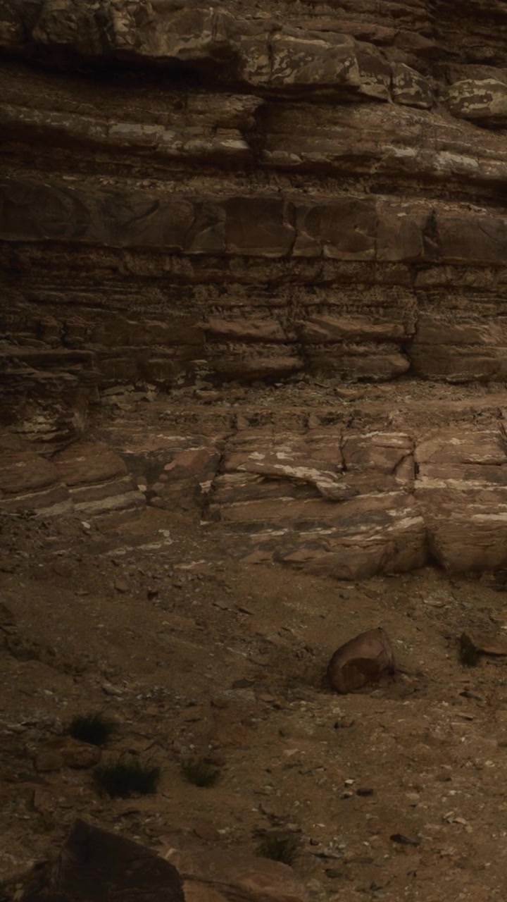 Warm colors and textures of rock formations in a desert canyon during the day