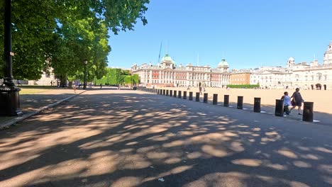 people walking on a sunny london street