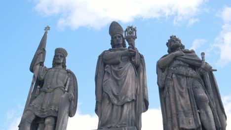 imposing stone statues against a cloudy sky