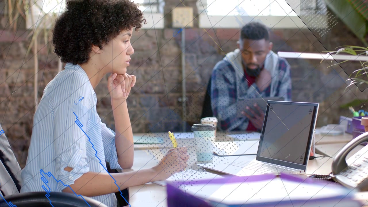Woman writing with yellow pen at desk as man tapping tablet, causing animated list for marketing