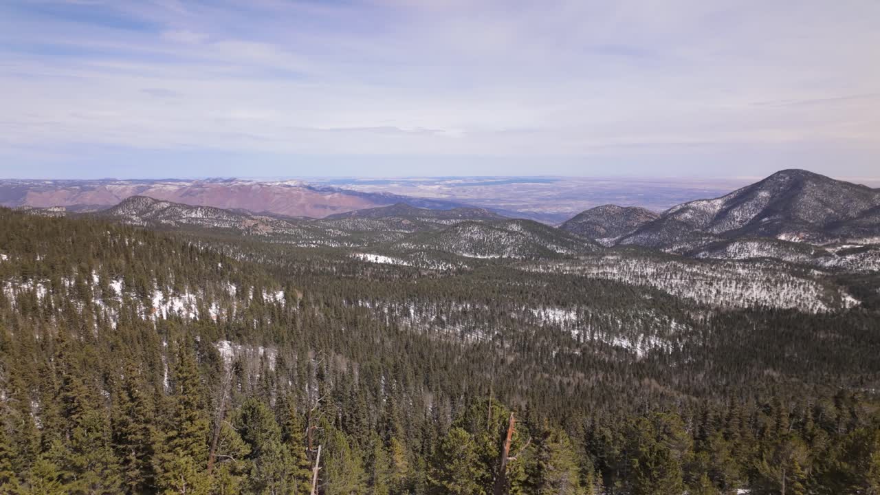 Vast Hilly Landscape In Snow Seen From Manitou And Pikes Peak Cog Railway In Winter. wide POV shot
