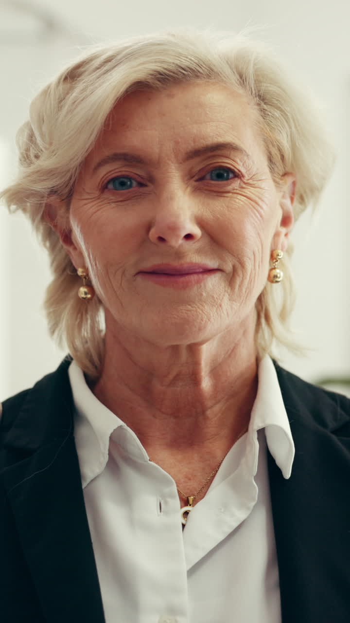 Close-up Portrait of a Happy Senior Businesswoman Smiling