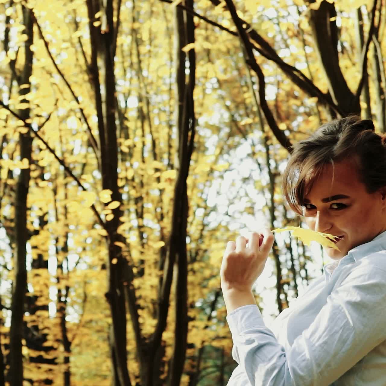 Beautiful female dreaming in the autumn park