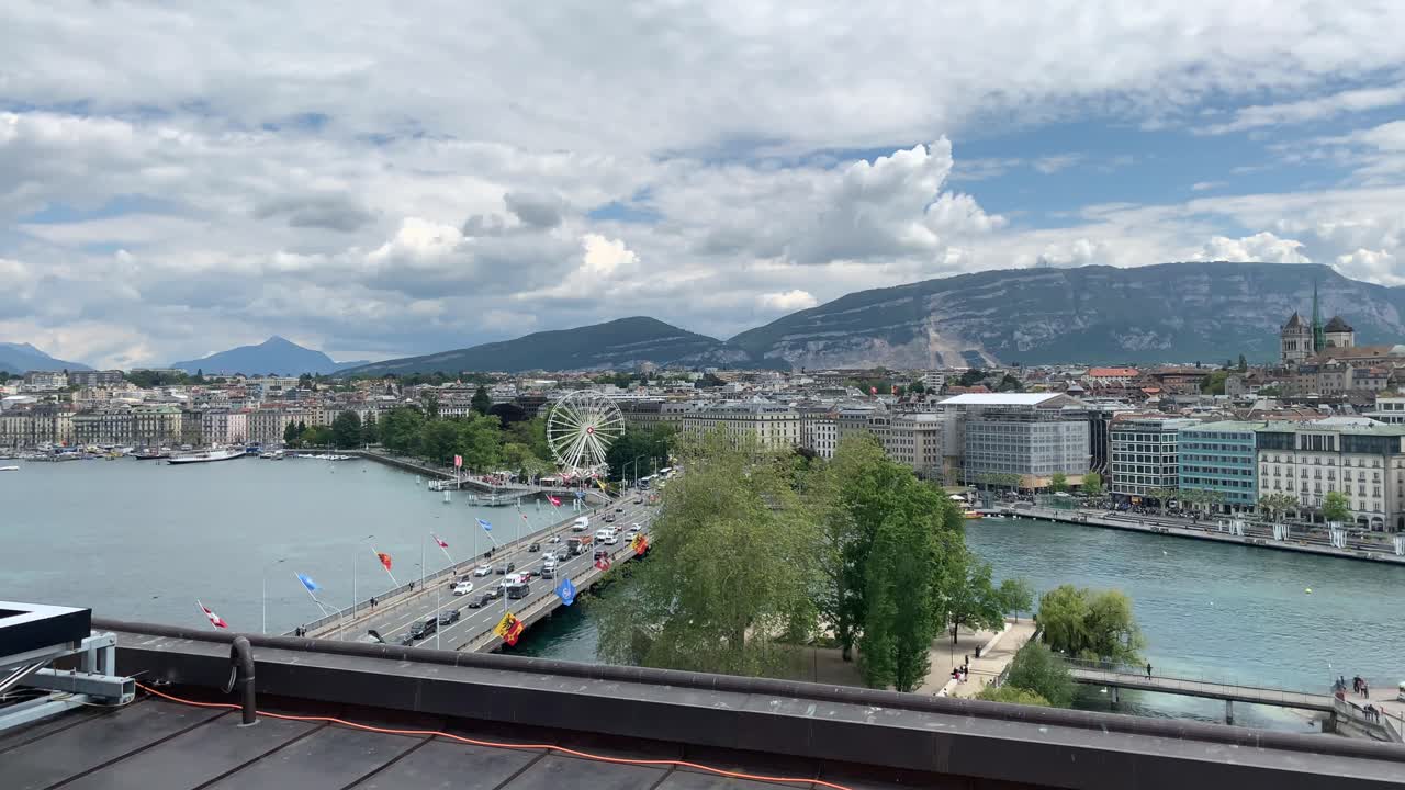 Slow panning panoramic view of Geneva, Switzerland from the roof of the Four Seasons Hotel des Bergues
