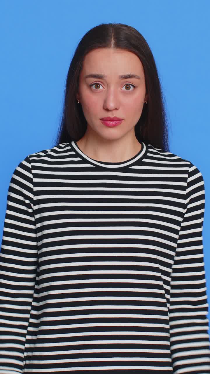 Caucasian woman in striped blouse pointing fingers herself feels innocent not her fault fail mistake