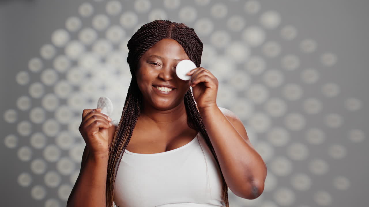 Woman using cotton pads for skincare