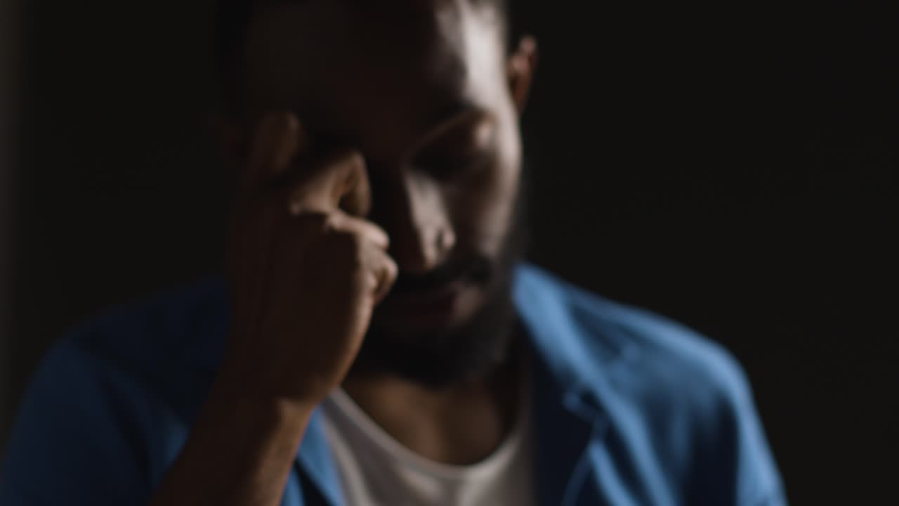 Low Key Close Up Portrait Of Man Struggling With Mental Or Emotional Problems 5