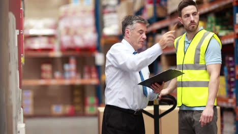 warehouse worker talking with his manager