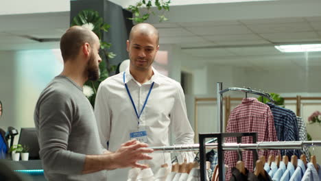 customer interacting with sales associate in a clothing store