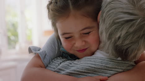 happy little girl hugging grandmother smiling embracing granddaughter loving granny enjoying affection at home family concept 4k footage