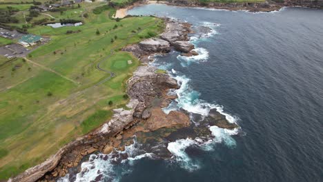 rocky coastline of little bay beach in sydney, new south wales, australia - aerial shot