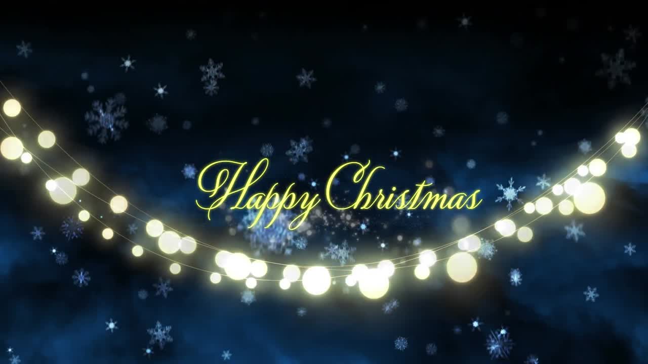 해피 크리스마스 텍스트 위에 내리는 눈의 애니메이션