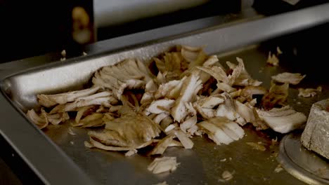close up shot of chicken shawarma being prepared on grill