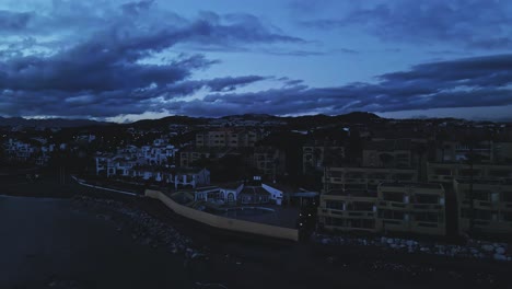 Evening-view-of-coastline-pan-left-into-the-sea-sunset