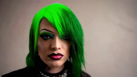 woman with green hair and dark makeup