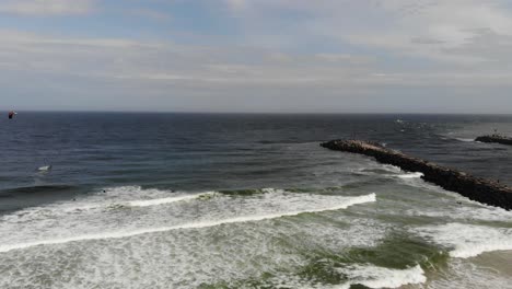 windsurfer and waves manasquan inlet , editorial