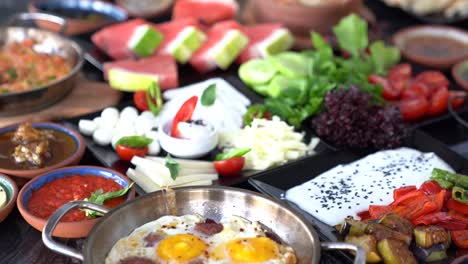 turkish breakfast on the table in restaurant. camera moves above the table.