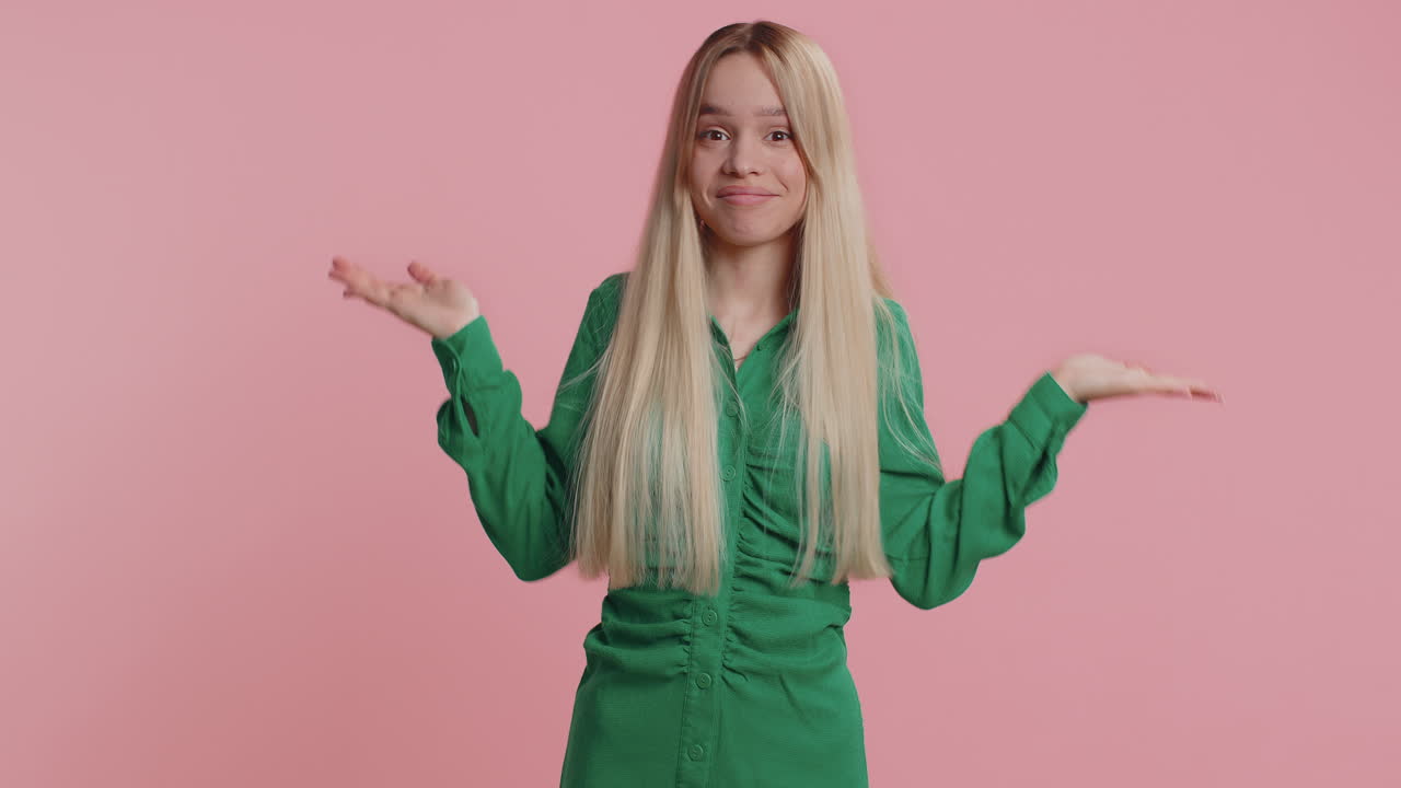 Puzzled clueless uncertain girl raising hands in helpless embarrassed confused by difficult question