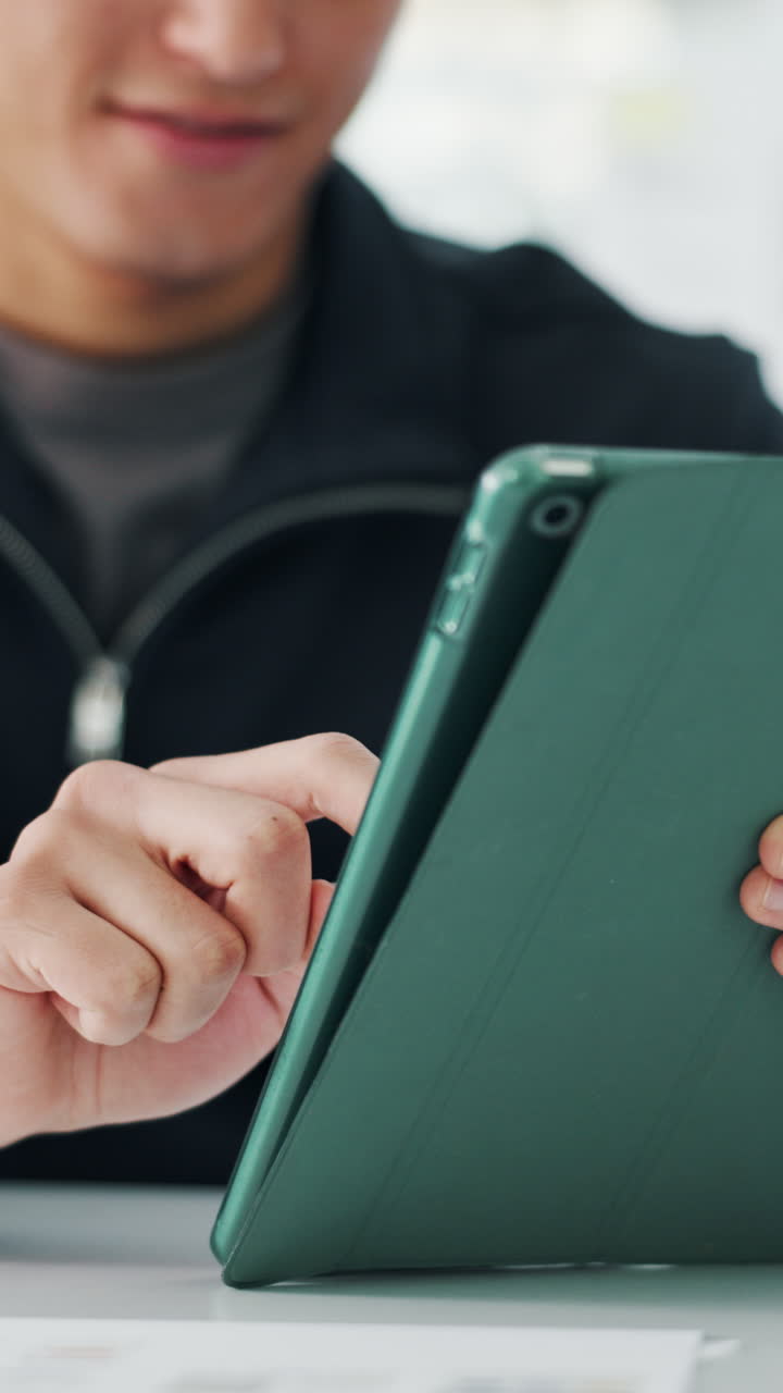 Close-Up of Hand Interacting with Digital Tablet
