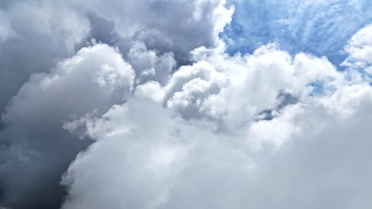 View Of The Blue Sky With Thick White Clouds. Aerial Shot