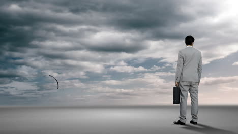 businessman looking at brainstorm in desert