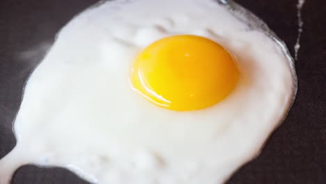 egg fried in a frying pan.