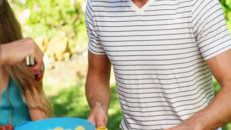 Family-having-meal-in-the-house-garden