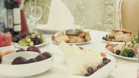 waiter serves the table rearranges food