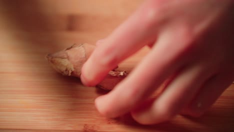 cutting up ginger root by hand