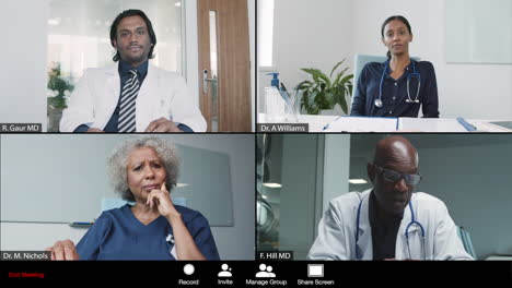 middle aged male doctor leading video conference with colleagues