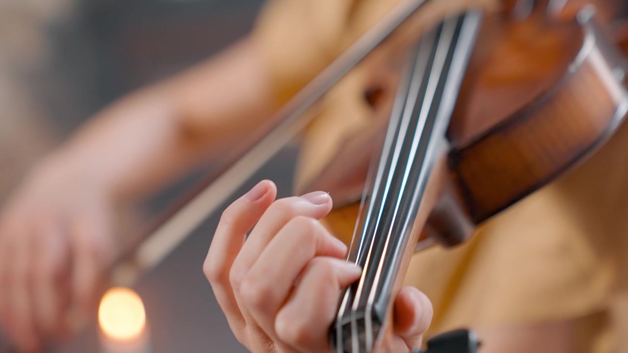 Close-up of Musician's Hands Playing Violin