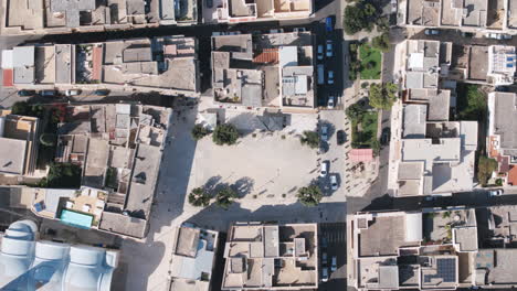 Top-down-static-aerial-timelapse-of-the-town-square-of-Pezze-di-Greco-in-southern-Italy