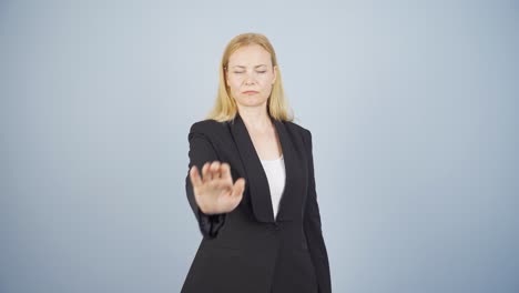 Business-woman-saying-stop-to-camera.