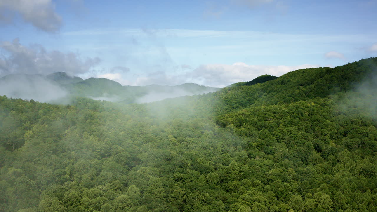Atmospheric drone shot of North Carolina’s fog-laden Smoky Mountains