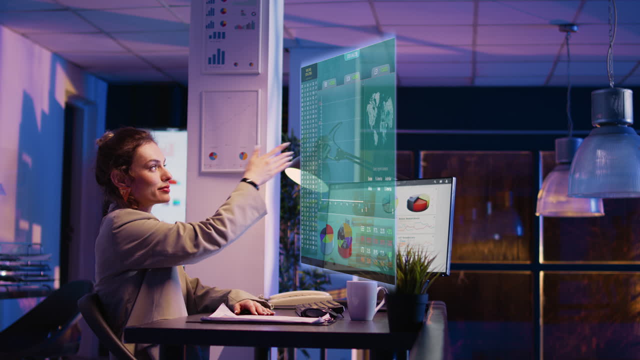 Office worker reviewing results hologram