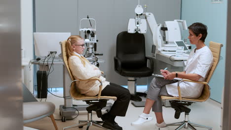 ophthalmologist talking with patient