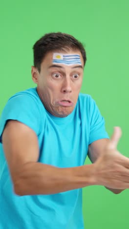 Man cheering for Uruguay, angry with the decision of referee