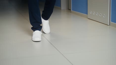 nurse walking in hospital corridor