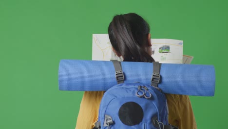 woman with a backpack and map