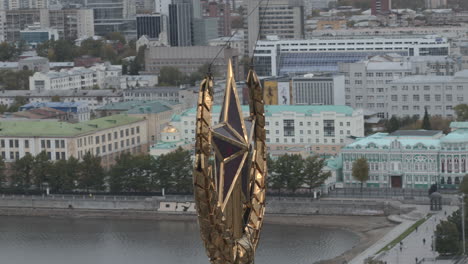 golden star monument over the city