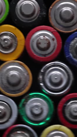the batteris stand tlosse together and form a beautiful buckground many used batteries from different manufacturers old batteries for recycling