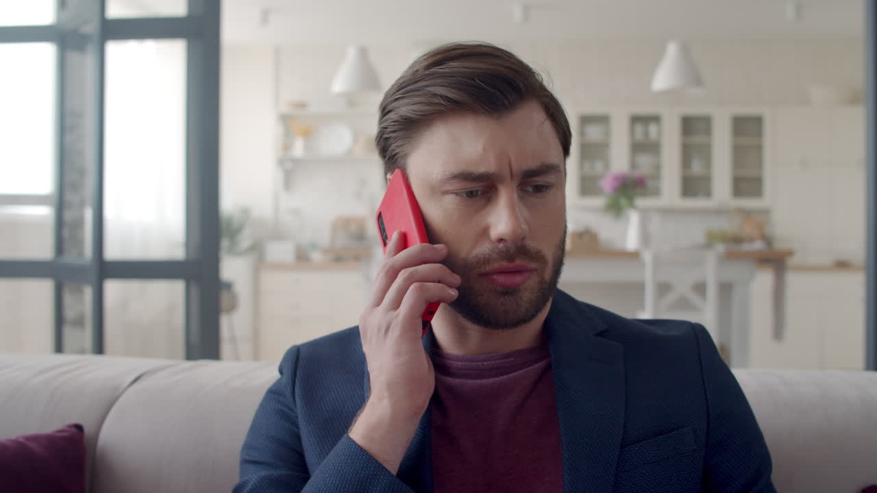 Focused businessman discussing business on phone. Guy feeling doubt.