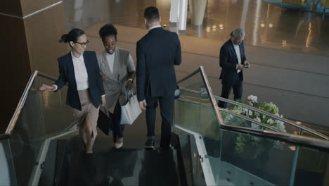 business people on stairs in a modern office building