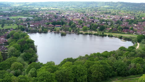 Aerial-flying-towards-Petersfield-Heath-Pond-Sunny-day-UK-4K