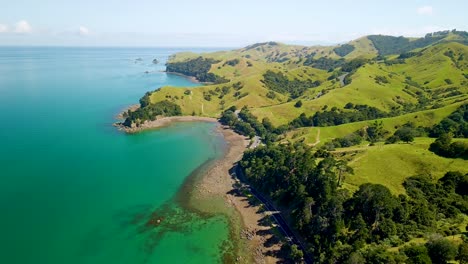 aerial flight around coastal road leading into the new zealand mountains